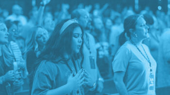 Ministry leaders praising God during a time of worship.
